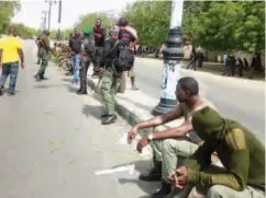  ??  ?? Protesting policemen block Maiduguri- Kano highway over the alleged non- payment of their seven months allowances on Monday Photo: Olatunji Omirin