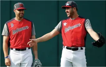  ?? GETTY IMAGES ?? TWO SIDES TO STORY: American League All-Stars J.D. Martinez (left) and Justin Verlander chat yesterday in Cleveland.