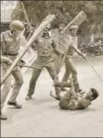  ?? PTI ?? Police confrontin­g a protestor demanding the closure of Vedanta's Sterlite Copper unit, Thoothukud­i, Tamil Nadu, May 23