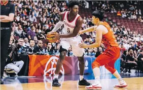  ?? VICTORY CREATIVE ?? R.J. Barrett of Team Canada is guarded by Qian Wu of Team China during the Pacific Rim Basketball Classic on Friday at Rogers Arena in Vancouver. The teams will continue their exhibition series on Sunday in Victoria.