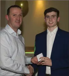  ??  ?? Seneschals­town’s Cathal Hickey receives his Leinster MFC medal from senior manager Andy McEntee at the underage presentati­on night in Navan O’Mahonys.