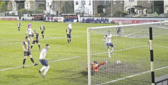  ?? (Photo: AFP) ?? Tottenham Hotspur’s Brazilian striker Carlos Vinícius Alves Morais (right foreground) scores their second goal during the English FA Cup thirdround football match between Marine and Tottenham Hotspur at Rossett Park ground in Crosby, north-west England, yesterday.