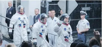  ??  ?? Corey Stoll, left, as Buzz Aldrin, Lukas Haas as Mike Collins and Ryan Gosling as Neil Armstrong star in First Man.