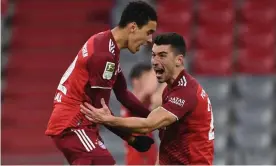  ?? Photograph: Christof Stache/AFP/Getty Images ?? Jamal Musiala (left) celebrates Marc Roca after scoring Bayern’s winner against Mainz.