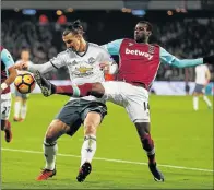  ?? Picture: GETTY IMAGES ?? FULL STRETCH: West Ham’s Pedro Obiang challenges Manchester United’s Zlatan Ibrahimovi­c during their Premier League match at the London Stadium