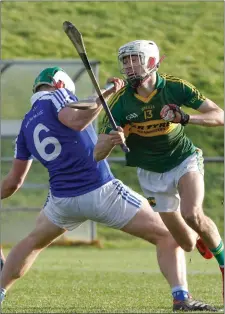  ??  ?? Cloughduv’s Brian Verling is taken down by Ballinamee­la’s David Phelan