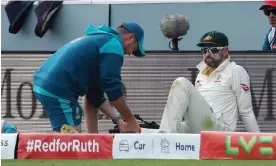  ?? ?? Nathan Lyon was treated by a physio after injuring his calf in the field. Photograph: Matt Impey/Shuttersto­ck