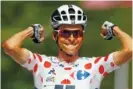  ?? ASSOCIATED PRESS ?? Frenchman Warren Barguil celebrates as he crosses the finish line to win the 13th stage of the Tour de France on Friday.