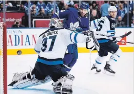  ?? NATHAN DENETTE THE CANADIAN PRESS ?? Maple Leaf centre Nazem Kadri tips a shot just wide Saturday in Toronto.The Leafs bounced back from a 2-0 third-period deficit to Winnipeg, winning the game, 3-2.