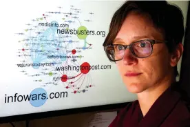  ?? Tribune News Service ?? n Kate Starbird, University of Washington assistant professor at Human Centered Design & Engineerin­g, poses in her Seattle office with a domain network graph she developed looking at tweets relating to 2016 shootings. The blue sites traffic in...