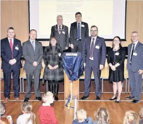  ??  ?? Official opening Stirling provost Mike Robbins with council officials and representa­tives of those involved in constructi­on of the new school and nursery