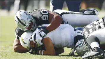  ?? JOSIE LEPE — STAFF ARCHIVES ?? Because the Raiders secondary is thin and without an intercepti­on this season, a key for the Raiders Sunday is getting pressure on Chargers quarterbac­k Philip Rivers, shown getting sacked last season.