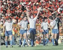  ?? Mark Lennihan Associated Press ?? U.S. PLAYERS are shown shortly after Paul Caligiuri scored a goal to give their team a 1-0 lead over Trinidad and Tobago in ’89.