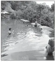  ??  ?? At the hotel Chapung Sebali, the Jungle Fish Bar is a draw for day-trippers who want to hang out at a pool in the tropical forest near Ubud.