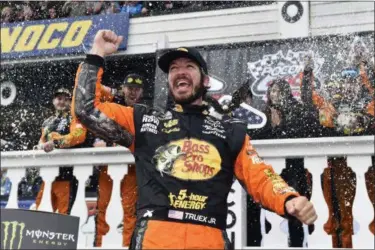  ?? DERIK HAMILTON — ASSOCIATED PRESS ?? Martin Truex Jr. celebrates after winning the NASCAR race June 3 in Long Pond, Pa.