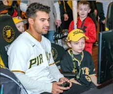  ?? ?? Justin Danowski, 10, goes head-to-head with Nick Gonzales in a video game Saturday at PirateFest.