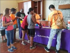  ?? JORDANA JOY — THE MORNING JOURNAL ?? Youngsters and their bigs played games and enjoyed ice cream at this year’s Big Brothers Big Sisters of Lorain County back to school ice cream social.