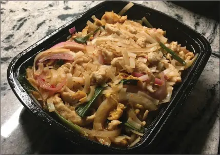  ?? (Arkansas Democrat-Gazette/Philip Martin) ?? As a takeout dish, Pad Thai filled the bill as well as our stomach. It was mildly spiced, flavorful and plentiful.