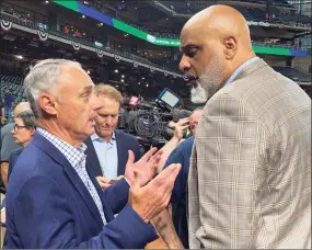  ?? Ron Blum / Associated Press ?? MLB Commission­er Rob Manfred, left, and MLB Players Associatio­n executive director Tony Clark speak before Game 1 of the World Series.