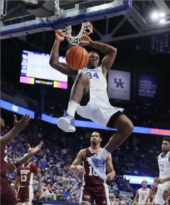  ?? Andy Lyons/Getty Images ?? West Virginia transfer Oscar Tshiebwe averages 16.3 points and an NCAA Division I-best 15.3 rebounds for No. 12 Kentucky.