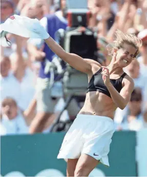  ?? ROBERT HANASHIRO/USA TODAY ?? Brandi Chastain famously celebrates winning the World Cup in 1999, ripping off her jersey after converting a penalty kick.