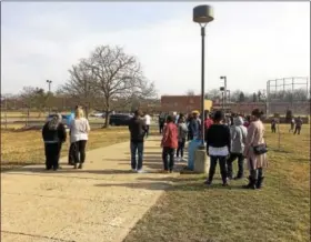  ??  ?? It took only two minutes for students at Pottstown High School to be evacuated after officials were made aware of a bomb threat. They were sent home without being allowed to re-enter the school until 6 p.,m.