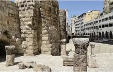  ?? Khaled Yacoub Oweis / The National ?? Top, the start of Saqf Al Seil street from the west. Above, the ruins of the Nymphaeum fountain, which was partially restored in 2015 but has no running water