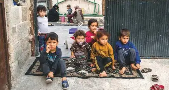  ?? New York Times News Service ?? Syrian refugee children in Akcakale, Turkey. Officials have kept a strong grip on the communitie­s along the border, with already 20 dead and 80 wounded inside Turkey.