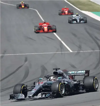  ?? AP ?? Mercedes driver Lewis Hamilton (foreground) of Britain leads during the Spanish Formula One Grand Prix at the Circuit de Barcelona-Catalunya racetrack in Montmelo, Spain, yesterday.