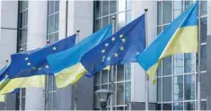  ?? — Reuters file photo ?? Flags of Ukraine fly in front of the EU Parliament building on the first anniversar­y of the Russian war, in Brussels, Belgium.