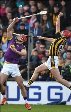  ??  ?? Lee Chin controls the ball with Cillian Buckley (Kilkenny) close at hand.