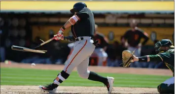  ?? DAN HONDA/STAFF ARCHIVES ?? The Giants’ Jae-Gyun Hwang breaks his bat against the A’s during spring training. He is set to join the Giants on Wednesday after starting the season in the minors in Sacramento.