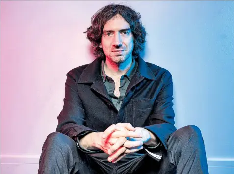  ??  ?? Back from the brink: Gary Lightbody, left, photograph­ed for The Telegraph last month; and with Snow Patrol in 2003, right