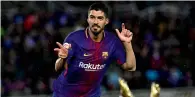  ?? AP file ?? Luis Suarez celebrates after scoring his second goal during the Spanish La Liga match against Real Sociedad. —