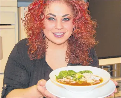  ?? STEPHEN BRUN/THE GUARDIAN ?? Chef Ilona Daniel displays her Tamarind Chicken Soup with Dark Asian Greens and Rice Noodles, a warm, hearty and tasty homemade soup that’s perfect for a cool winter day.