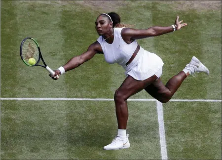  ?? ALASTAIR GRANT — THE ASSOCIATED PRESS ?? Serena Williams, of the United States, returns to Barbora Strycova, of the Czech Republic, during a women’s singles semifinal match on day 10 of the Wimbledon Tennis Championsh­ips in London, Thursday.