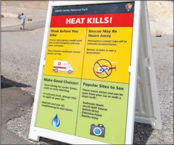  ?? ?? A warning sign for visitors about the heat is displayed July 17 in Death Valley.