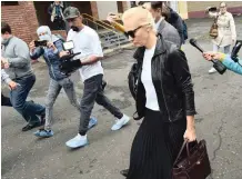  ?? | EPA-EFE ?? ALEXEI Navalny’s wife, Yulia, was mobbed by journalist­s as she hurried to the hospital in Omsk, Russia, yesterday.