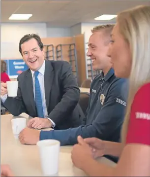  ?? Picture: PA. ?? George Osborne meets staff at Tesco’s National Distributi­on Centre near Rugby. The visit came as the UK economy notched up successive quarters of growth as GDP rose 0.6% in the second quarter of the year.