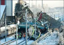  ?? TUMAY BERKIN / REUTERS ?? Rescuers search for survivors after nine died when a train hit an engine and a walkway in Ankara, Turkey, on Thursday.