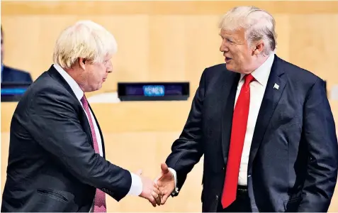  ??  ?? Blond on blond: Boris Johnson and Donald Trump shake hands at the UN headquarte­rs in New York, where Mr Johnson will meet Theresa May later this week