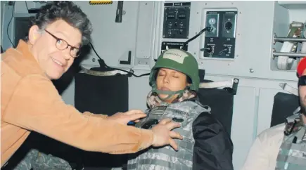 ??  ?? Al Franken says he is now “disgusted with myself” for his actions in the photo that was taken while Leeann Tweeden was sleeping.