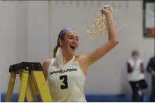  ?? AUSTIN HERTZOG – MEDIANEWS GROUP ?? Spring-Ford’s Lucy Olsen waves the net after cutting it down following the Rams’ PAC-title clinching win over Perkiomen Valley on Feb. 12.