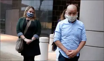  ?? Houston Chronicle via AP
Karen Waren/ ?? In this Jan. 21 photo former Houston Police Officer Tam Pham walks out of the Federal Courthouse downtown in Houston after he appeared in court following his arrest Wednesday on federal charges tied to Capitol violence.