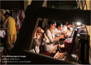  ?? ?? A traveling opera troupe getting ready for a performanc­e at a rural theater