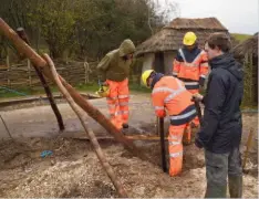  ??  ?? Above: a- frame posts were sunk into pits at each corner and at the mid-point of the roof