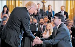  ?? MARK WILSON/GETTY ?? President Trump surprises Robert Wilkie with the Veterans Affairs nomination announceme­nt during a prison policies event Friday in the East Room of the White House.