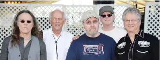  ??  ?? Timothy B. Schmit (from left), Paul Cotton, George Grantham, Rusty Young and Richie Furay of Poco in 2009.