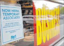  ?? Lynne Sladky The Associated Press ?? A sign in Coral Gables, Fla., advertises hiring of temporary workers at a Pier 1 retail store, which is going out of business amid the coronaviru­s pandemic.