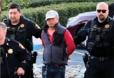  ?? COURTESY OF KATI MCHUGH ?? Video screen capture of Chunli Zhao , 67, the suspect in the killing of seven people, being taken into custody in Half Moon Bay on Monday, Jan. 23.